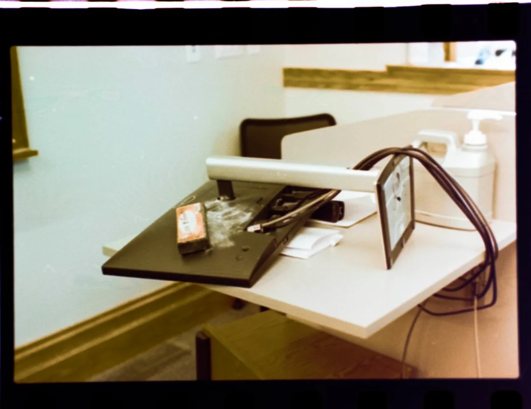 Colleagues interact in a modern office setting, blending technology with workplace hygiene.